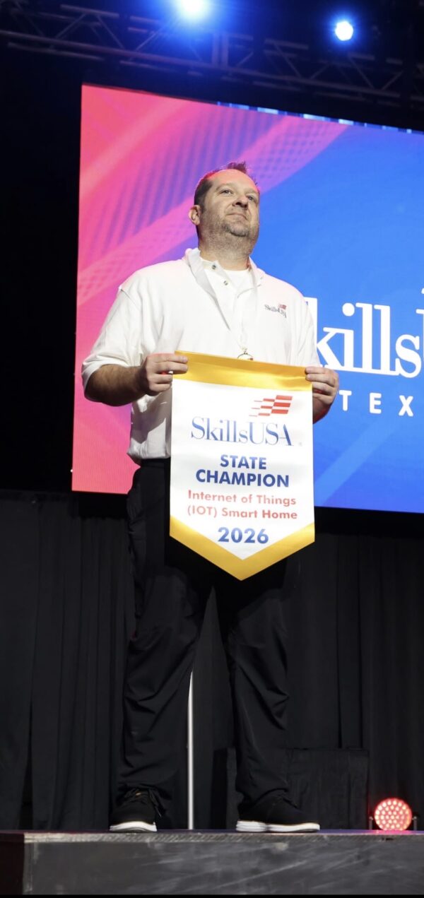 Sonny Bever holding his SkillsUSA State Gold medal in IoT Smart Home